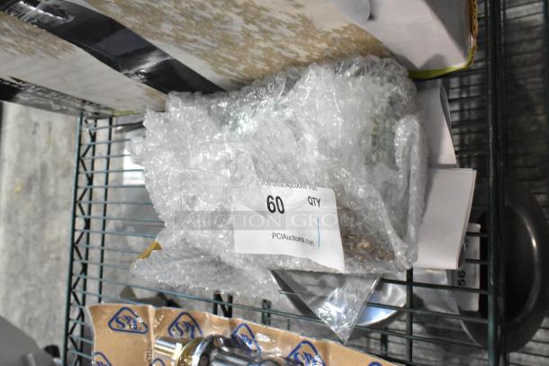New Hobart 00-975125 unit with minor scratches, wrapped in bubble wrap. Tag indicates quantity "60."