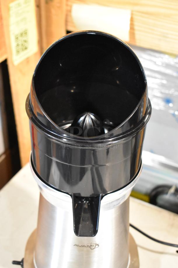 BRAND NEW AvaMix 928CJ1400 stainless steel electric citrus juicer. 120V, 1 phase. Minor scratches, visible brand logo.