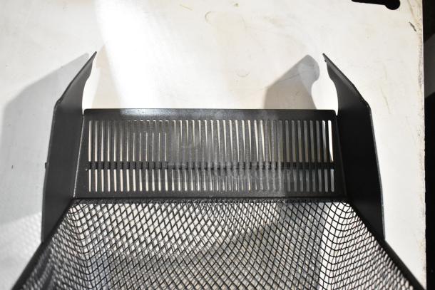 Black mesh unit, brand new with minor scratches and dents, features a slotted and angled design.
