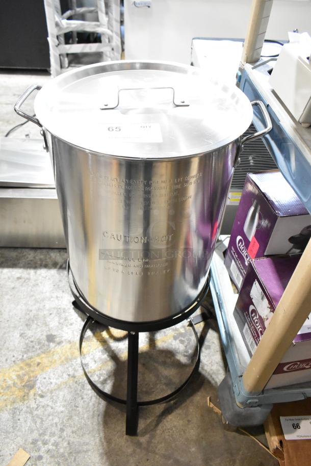 Brand new metal propane single burner with deep fryer stock pot; minor scratches; “Caution Hot” and fill lines visible.