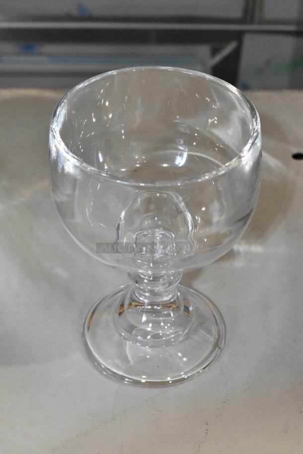 Brand new Acopa 21 oz. schooner glass, clear, slight scratch and dent, ideal for beverages, 11 per pack.