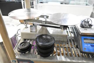 Brand new AvaWeigh 334SBD16 dough scale, 16 lb. x 0.25 oz., includes 5 weights, slight scratches, with AvaTek branding.