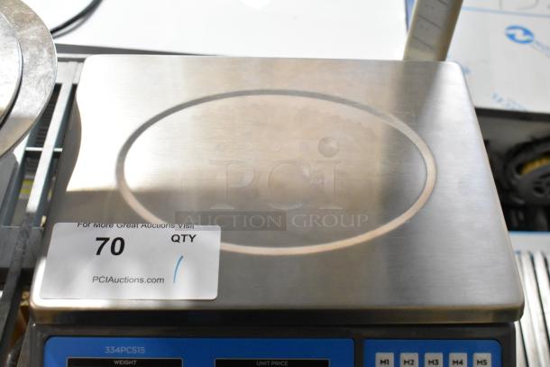 AvaTek PCS15 15 lb. digital price computing scale, legal for trade, new with minor scratches, model 334PCS15, auction tag visible.