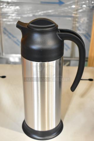 Stainless steel insulated carafe, 34 oz., black lid and handle, new condition, slight scratch and dent.