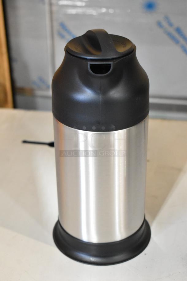 Brand new Choice 24 oz. stainless steel insulated carafe, model 922SV70, shown with black lid and base.