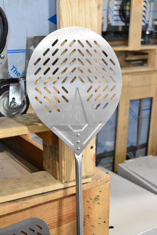 Auction lot of 9 brand new pizza peels, scratch and dent condition, various sizes, perforated metal blade, durable handle.