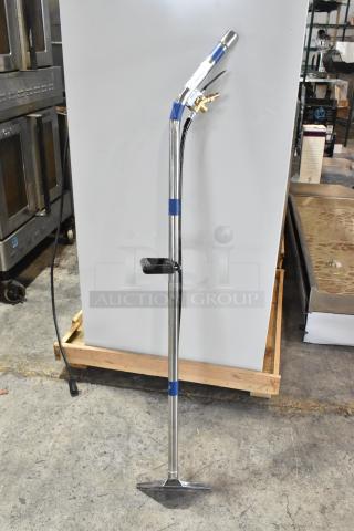 Brand new cleaning machine attachment, chrome finish, scratch and dent condition, with brass fittings and ergonomic handle.
