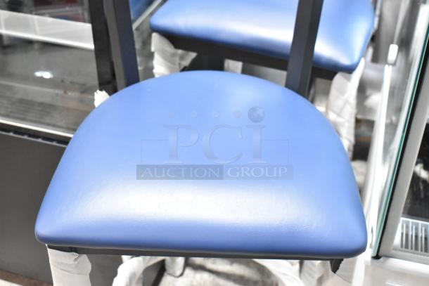 Brand new black metal bar height chair with wooden backrest and blue seat cushion, minimal scratches.