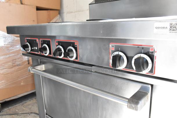 Garland stainless steel 6 burner electric range with oven, commercial casters, 120/250V, 3 phase, control knobs visible.