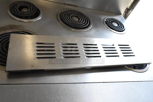 Garland stainless steel 6-burner electric range with oven, on commercial casters. 120/250V, 3 phase. Clean, working condition.