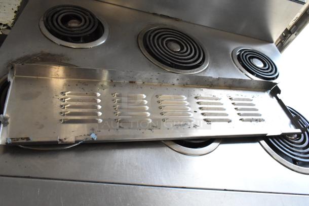 Garland Stainless Steel 6 Burner Electric Range with Oven on Casters, 120/250V, 3 Phase, commercial use, worn condition.