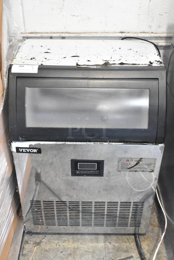 Vevor SKF-E150F undercounter ice machine, 110V, 1 Phase. Visible wear on top. Includes digital control panel and caution label.