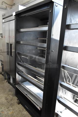 Lakeside metal commercial bakery display rack with multiple shelves and casters. Sturdy condition, ideal for bagels and pastries.