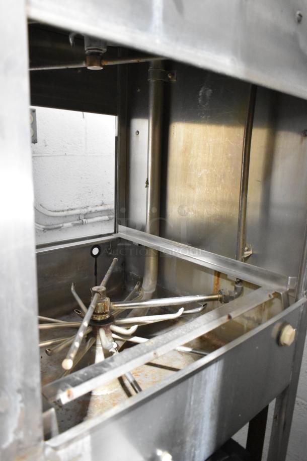 Jackson 150B stainless steel commercial straight pass-through dishwasher interior. Visible wear, 208/220V, 3 phase.