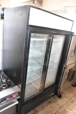 True 2-door reach-in cooler merchandiser with poly-coated racks, 115 volts, 1 phase. Features glass doors and brand logo.
