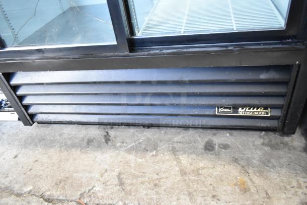 True Metal Commercial 2 Door Reach In Cooler, visible True brand label. Features poly coated racks, 115 volts, 1 phase.