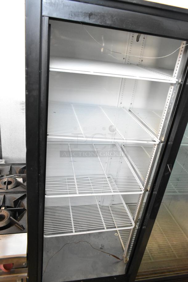 True Metal Commercial 2 Door Reach In Cooler with poly-coated racks. 115 Volts, 1 Phase, lightly used condition.