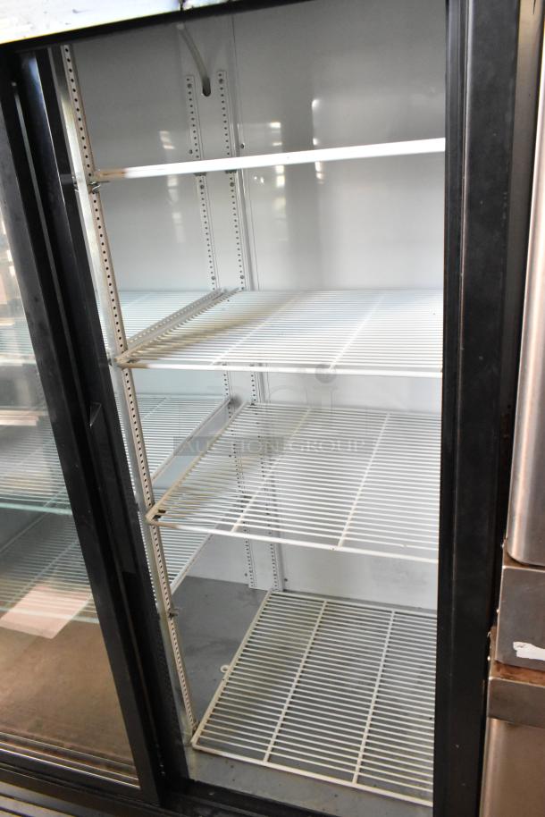 True Metal Commercial 2 Door Cooler Merchandiser with poly-coated racks, 115 Volts, 1 Phase, excellent condition.