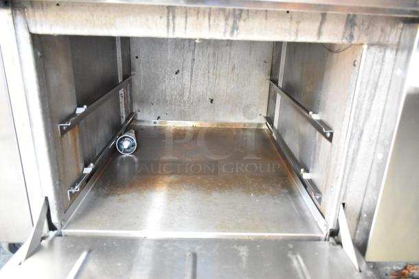 2018 Therma-Tek TMD48-8-2N, stainless steel, 8-burner range with 2 ovens, natural gas powered, shown with clean interior.