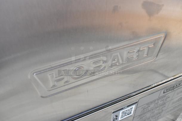 2019 Hobart LXEH stainless steel commercial undercounter dishwasher, embossed logo visible, model details on label.