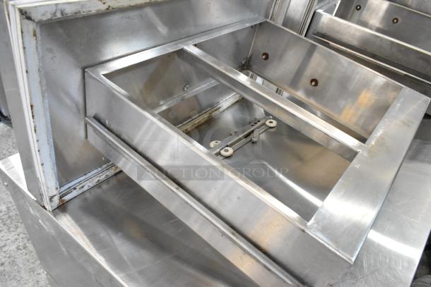 Two stainless steel cooler drawers with mounting brackets, slightly worn. Auction includes double your bid quantity.
