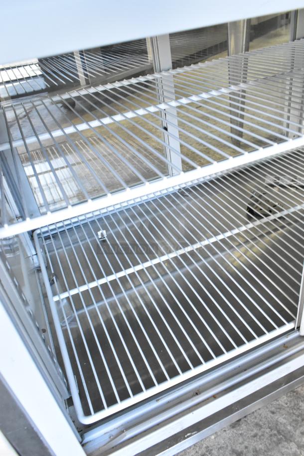 Randell 40048A stainless steel refrigerated display case, see-thru, with wire shelves. Commercial grade, 115V, 1 phase.