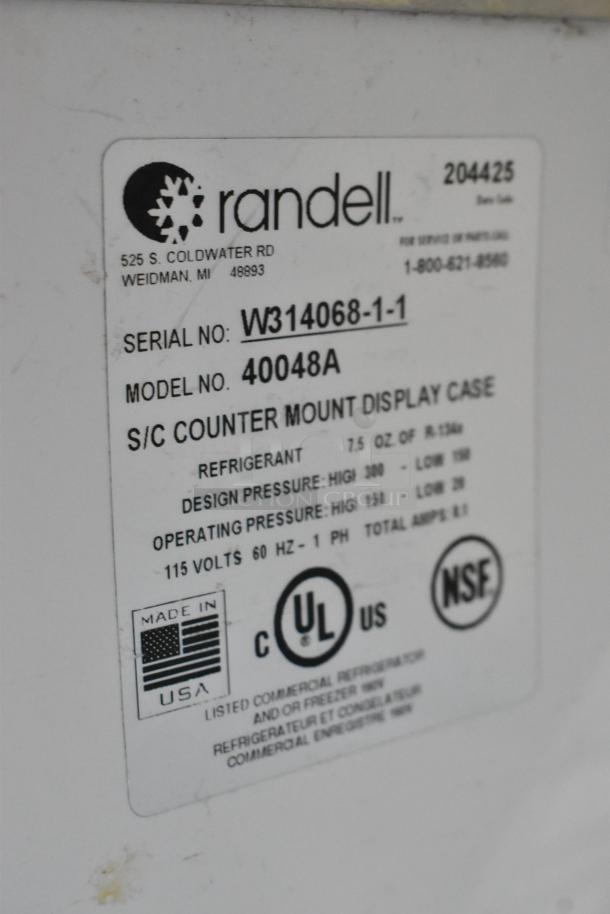 Randell 40048A stainless steel refrigerated display case label. Model 40048A, 115V, NSF certified, Made in USA.