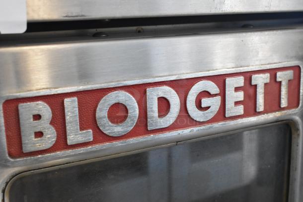 Blodgett stainless steel commercial gas convection oven, full size, view-through doors, metal racks, thermostatic controls.