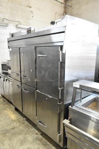 Traulsen RDT332NUT-HHS stainless steel commercial refrigerator/freezer, 3-section, 6 half doors, on casters, metal racks included.