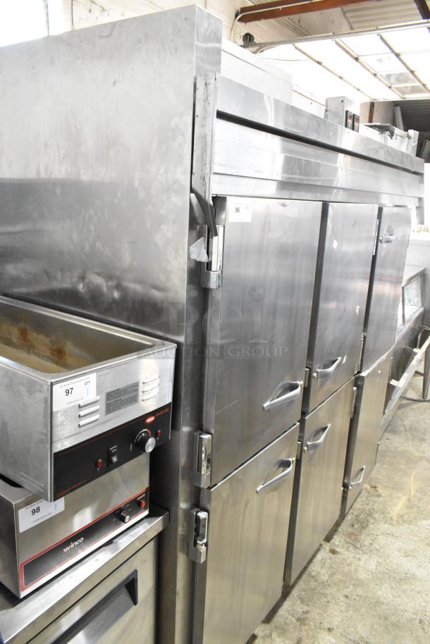 Traulsen RDT332NUT-HHS stainless steel 60.7 Cu. Ft. refrigerator/freezer, three-section, six half doors, on commercial casters.