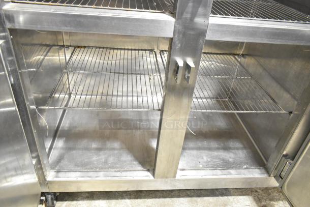 Traulsen RDT332NUT-HHS stainless steel reach-in refrigerator/freezer with metal racks and casters, 60.7 cu. ft.