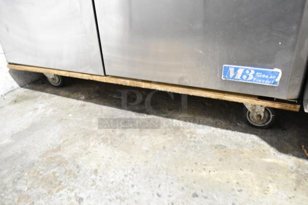 Turbo Air MUF-48 stainless steel 2-door undercounter freezer on commercial casters, with M3 label visible.