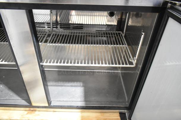 Turbo Air MUF-48 stainless steel undercounter freezer with two doors, commercial casters, adjustable shelves, excellent condition.