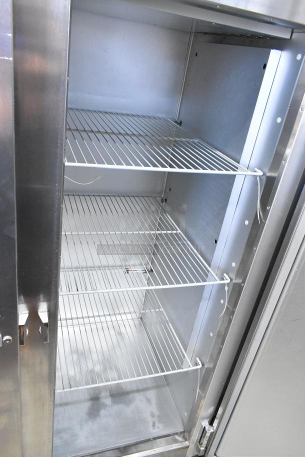 2016 Traulsen G20010 stainless steel 2-door cooler, poly-coated racks, commercial casters, left door locked, 115V.