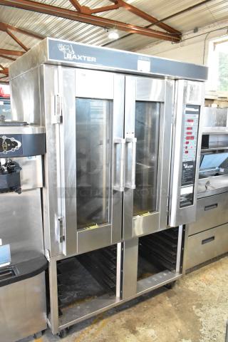 Baxter stainless steel gas-powered mini rotating rack oven on double pan rack with commercial casters; excellent condition.