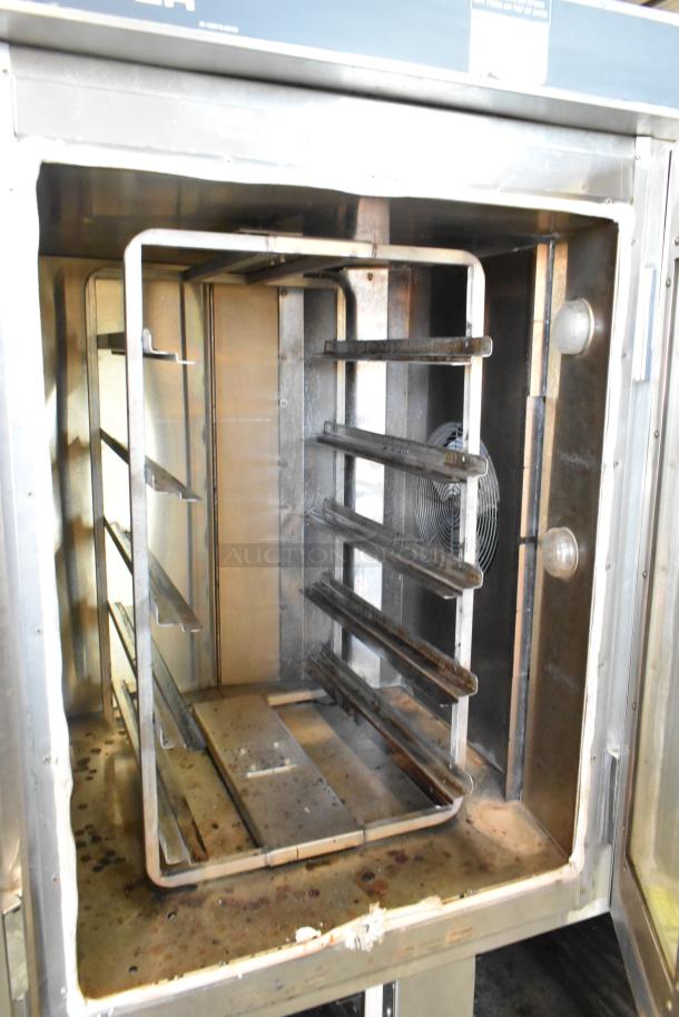 Baxter stainless steel commercial natural gas mini rotating rack oven, fits double pan rack, with commercial casters.