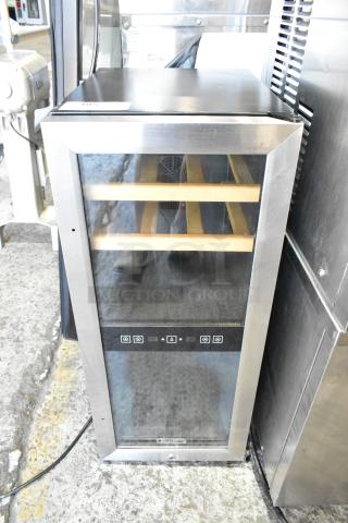 Koldfront TWR247ESS metal mini thermoelectric wine cooler, 115 volts, 1 phase, with glass door and interior wooden shelves.