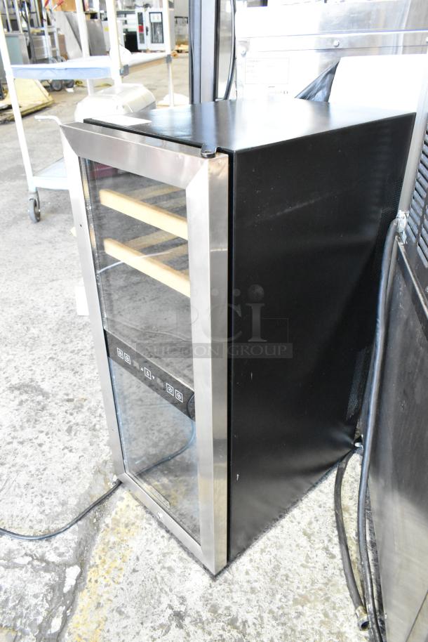 Koldfront TWR247ESS metal mini thermoelectric wine cooler, 115V, 1 phase. Features glass door, wood shelves, good condition.