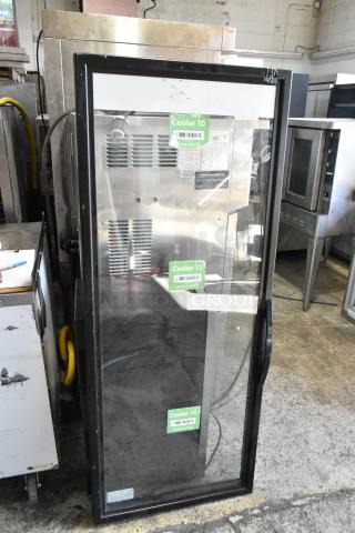 Glass door for merchandiser in good condition, black frame, visible labels for Cooler 10, Cooler 13, and Cooler 16.