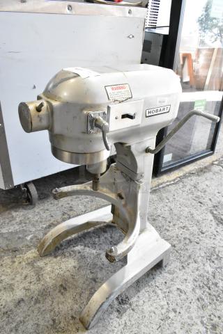 Hobart metal commercial countertop 20-quart planetary dough mixer, used, with visible wear; 115 volts, single phase, model details shown.