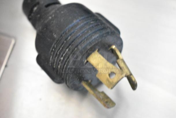 The image shows a close-up of a black power plug compatible with the 2018 Schaerer Barista Espresso Machine.