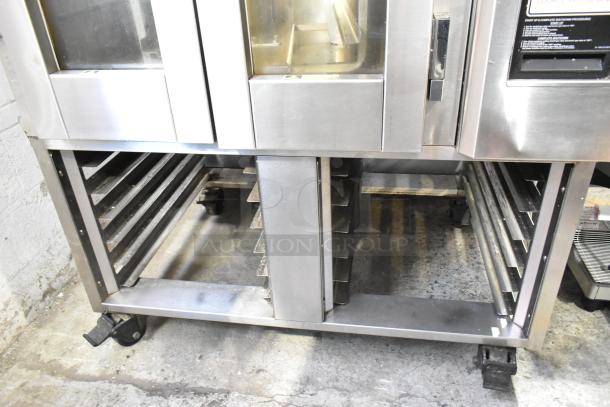 Baxter stainless steel commercial mini rotating rack oven, natural gas powered, includes double pan rack and commercial casters.