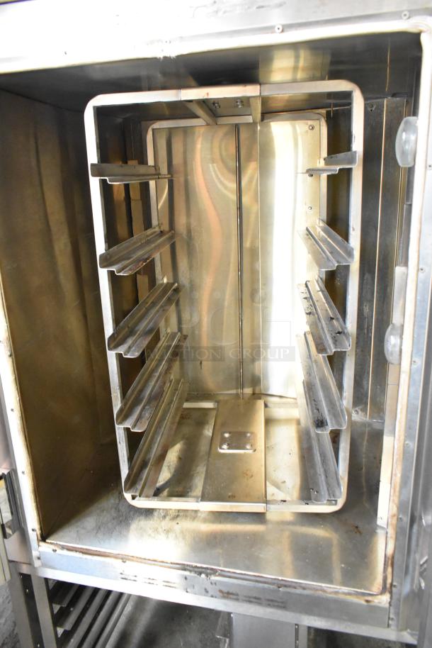 Baxter stainless steel rotating rack oven, commercial grade, natural gas powered, includes double pan rack and casters.