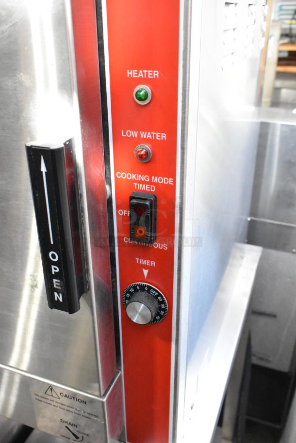 Vulcan VPX5 stainless steel steam cabinet with control panel, heater, timer, water indicators, and caution labels. 208V, 1/3 phase.