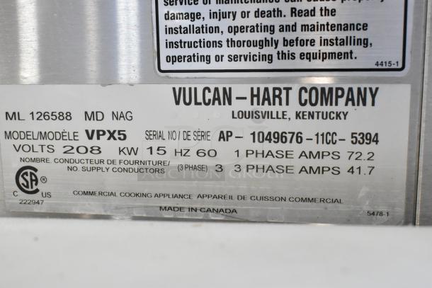 Vulcan VPX5 stainless steel steam cabinet on stand, 208V, 1/3 phase. Label shows model, serial number, and power details.