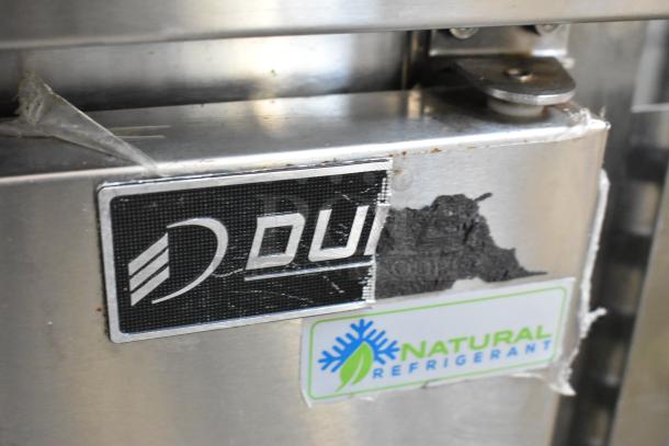 Dukers DSP48 sandwich salad prep table with stainless steel finish, worn logo label, and natural refrigerant marking.