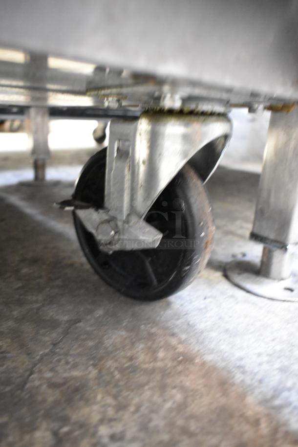 Dukers DSP48 prep table caster, showcasing commercial-grade wheel and metal frame. Durable and mobile.