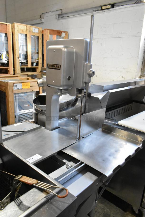 Hobart 5212 commercial floor meat saw, metal construction, 200-230V, 3 phase, clean condition, visible Hobart branding.