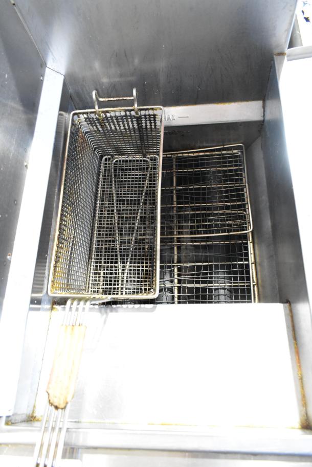 Vulcan LG300 stainless steel deep fat fryer with metal fry basket, 90,000 BTU, commercial use, natural gas powered.