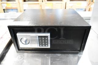 Black metal safe with digital keypad, no combination included; slightly used condition.